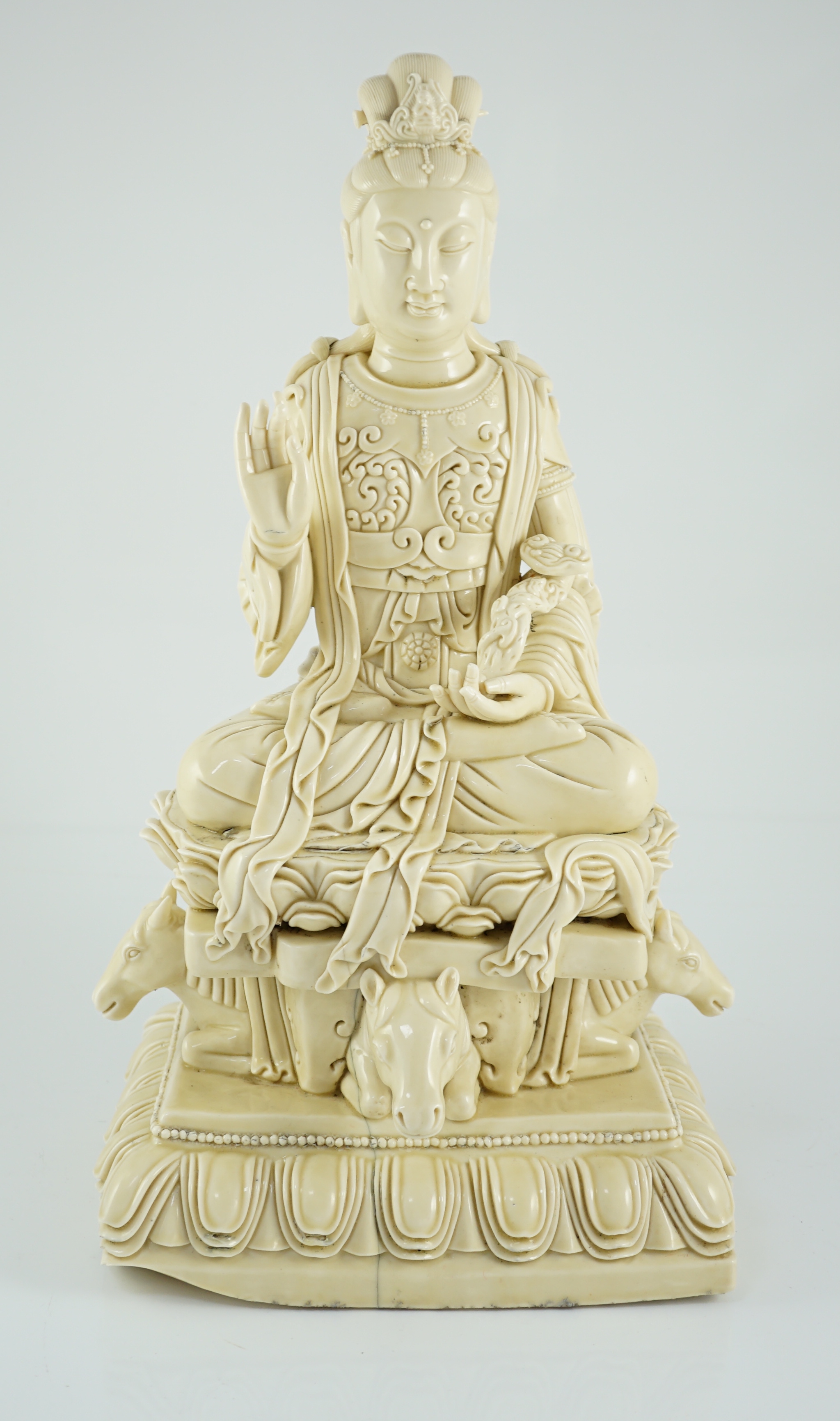 A large Chinese Dehua blanc de chine figure of Guanyin, Republic period, He Chaozong mark within a double gourd